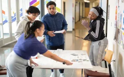 Students working around a table