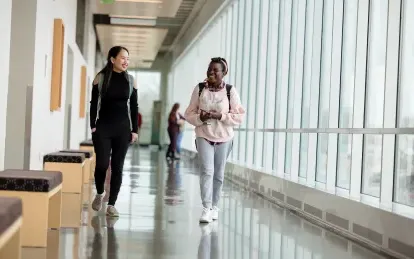 Two students walking and talking