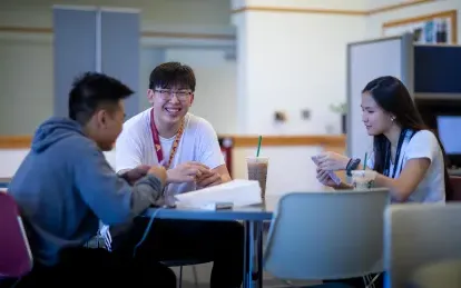 Students working around a table